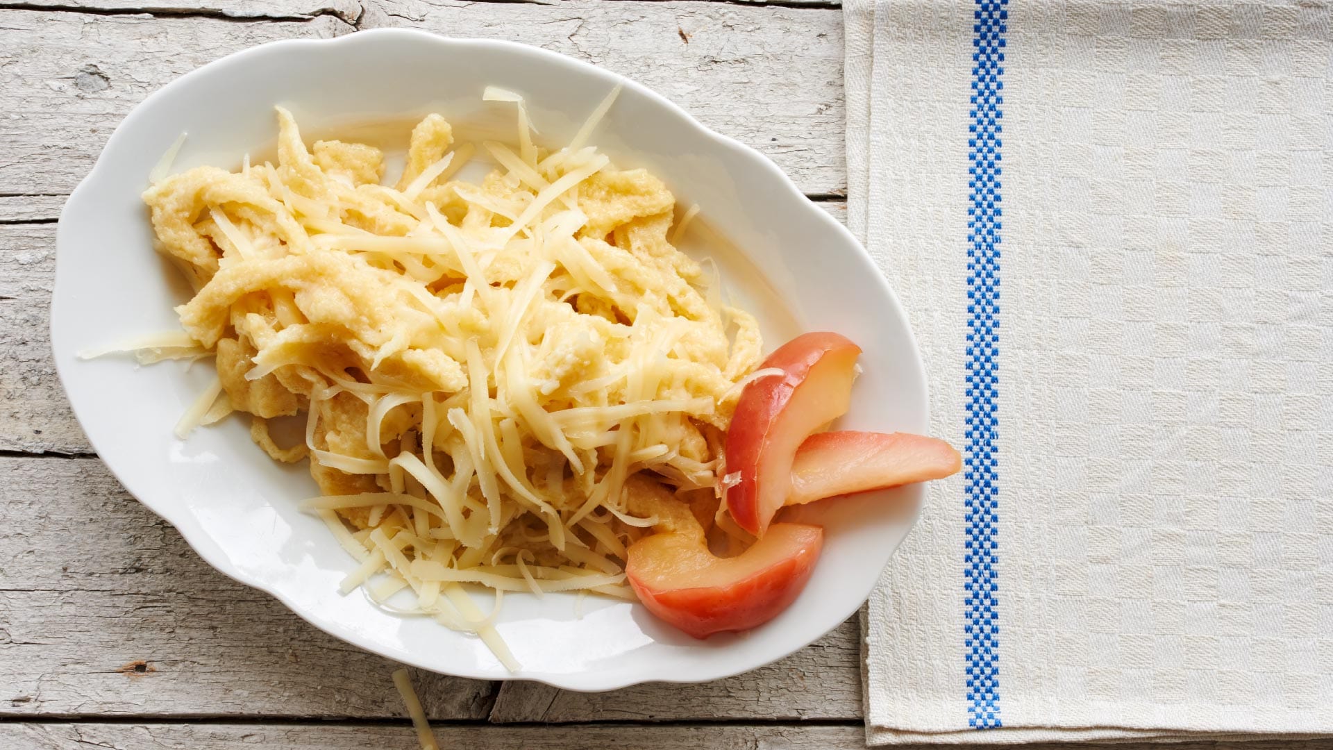 Emmentaler AOP cheese spaetzle (home-made pasta) with apple slices ...